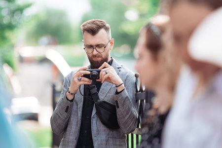 male tourist is viewing a photo on his camera.の写真素材