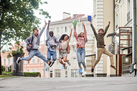 happy group of students having fun on a city street.の写真素材