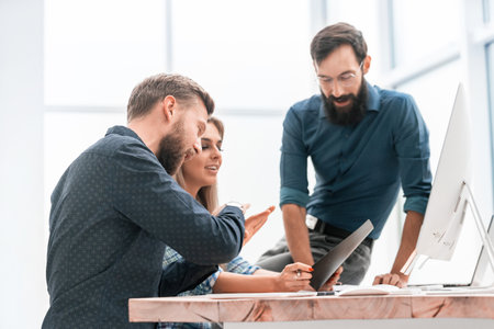 colleagues extending their hands to each other for a handshakeの写真素材