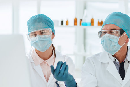 group of scientists using a computer to classify data.の写真素材