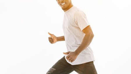 side view. smiling handsome guy showing thumbs upの写真素材
