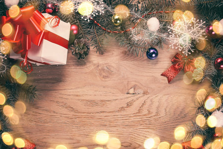 Christmas wreath and gift on wooden backgroundの写真素材