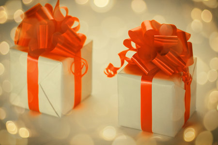 two white gift box with red ribbon .isolated on whiteの写真素材