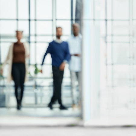 image in blur. group of young business people walking through an office hall.copy of the text spaceの写真素材