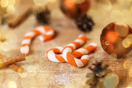 background image cookies,Christmas balls and cones on wooden background. beautiful bokeh effect from a garland.の写真素材