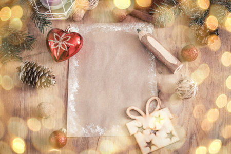 Christmas blank card on wooden background. retro style. beautiful bokeh effect from a garland.の写真素材