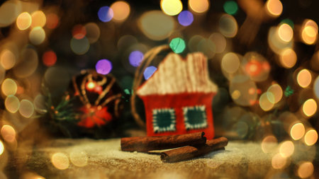 Christmas decorations and cinnamon sticks on a festive background. beautiful bokeh effect from a garland.の写真素材