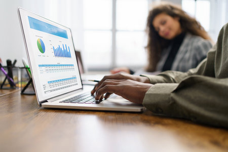 business man using a laptop to check financial data.