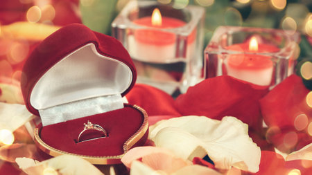 romantic composition for Valentines day on a red background. Beautiful bokeh effect from a garland.の写真素材