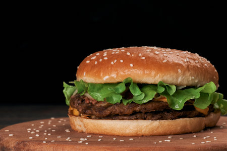 close-up. delicious hamburger on a wooden board.の写真素材