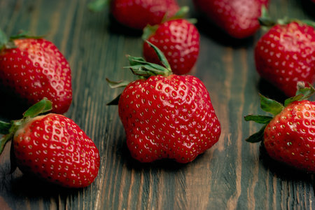 close-up. juicy strawberries on a wooden background.の写真素材