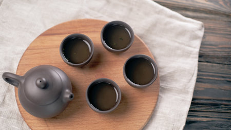 asian tea set on a wooden board. tea traditions.の写真素材