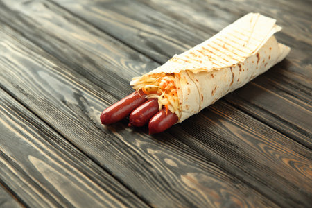 homemade sausages in pita bread on wooden background.photo with copy spaceの写真素材