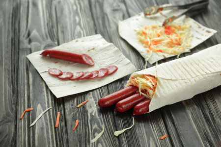 sausages wrapped in pita bread.preparation of Shawarma.photo with copy spaceの写真素材