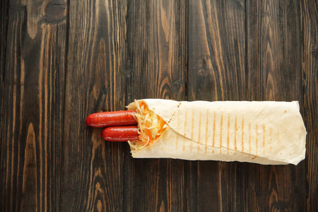 homemade sausages in pita bread on wooden background.photo with copy spaceの写真素材