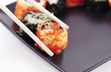 closeup.sticks and a set of Sushi rollsの写真素材
