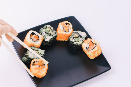 closeup.sticks and a set of Sushi rollsの写真素材