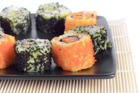 Sushi Set - different types of Maki sushi and chopsticks on a bの写真素材