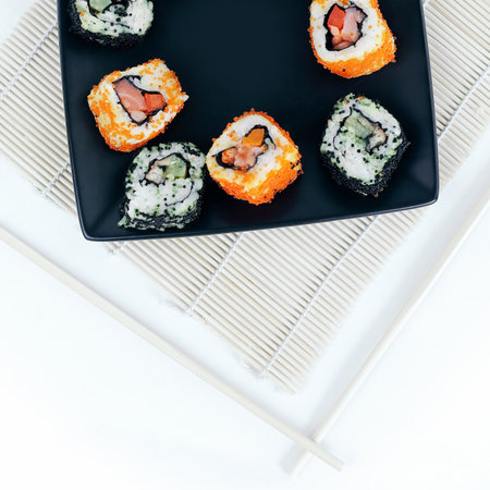 different types of Maki sushi on a black plateの写真素材