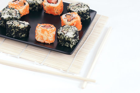 different types of Maki sushi on a black plateの写真素材