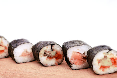 sushi rolls on a cutting Board.isolated on whiteの写真素材