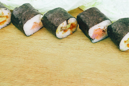 sushi rolls on a cutting Board.isolated on whiteの写真素材