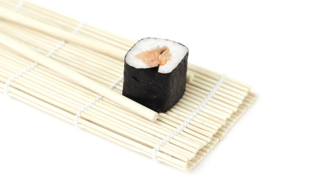 large sushi and chopsticks .isolated on a lightの写真素材