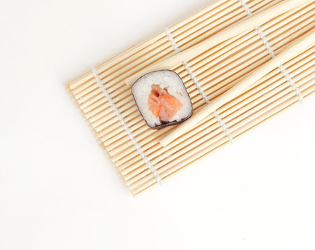 large sushi and chopsticks .isolated on a lightの写真素材