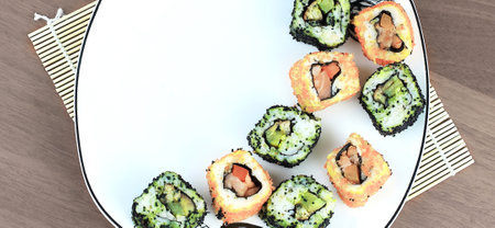 close-up of sushi and chopsticks on a white plateの写真素材