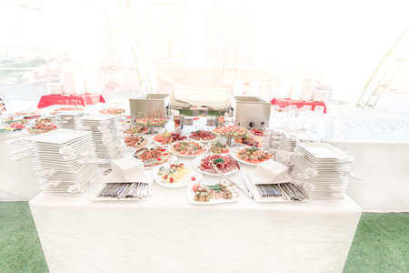 variety of snacks and dishes on the table in the restaurantの写真素材