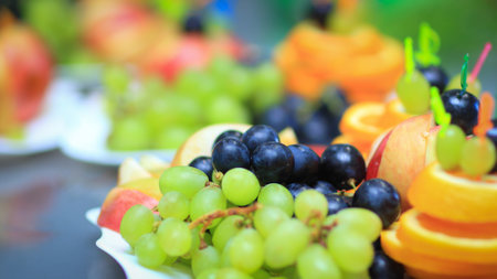 variety of fruits on the table in the restaurantの写真素材
