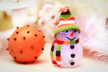 beautiful snowman and festively decorated orange Christmas backgroundの写真素材