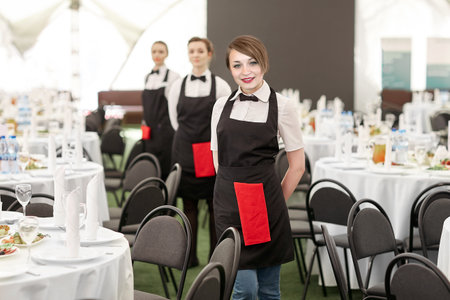 waitresses standing in the Banquet hall of the restaurantの写真素材