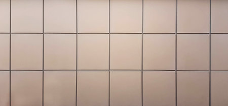 light facing tiles on the wall of a city buildingの写真素材