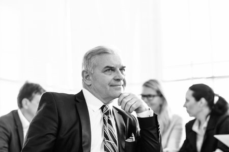 close up. thoughtful businessman sitting at the Desk in the office .