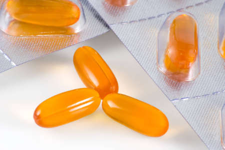 Yellow pills are photographed a close-up