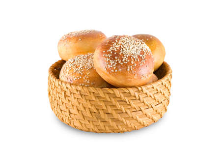 Bast-basket with buns is photographed on the white backgroundの写真素材