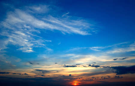 Clouds on a sunset on the blue sky backgroundの写真素材