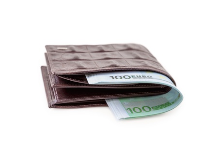 The brown  leather wallet with euro is photographed on the close-upの写真素材