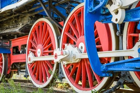 Wheels of a steam locomotive is photographed closeup