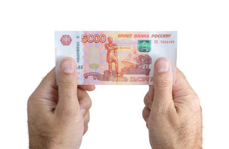 Banknote are in denominations of 5000 rubles in hands