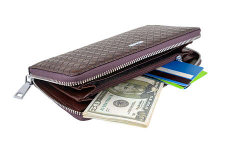 Wallet with dollars and card is photographed close-up