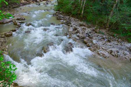 Mountain river flowing among the stone coastsの写真素材