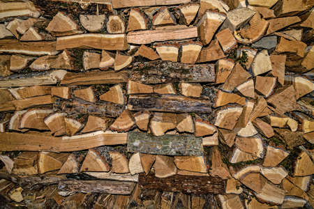 Woodpile of chopped oak firewoodの写真素材