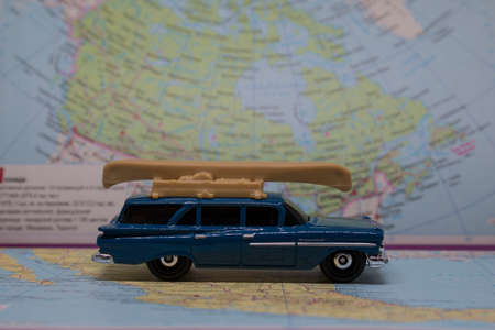 We are planning a trip by car. Car model on the world map. Where to go to travel by carの写真素材