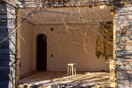 Broken window in a wooden frame in an old wooden house. An old abandoned house. Empty windows.の写真素材