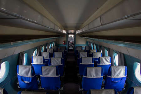 The cabin of a small passenger old plane. Empty cabin of an old liner. The salon is ready to receive...