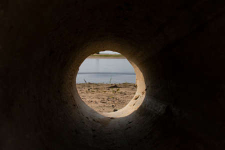 View from the pipe that drains the vodlu into the river. Discharge of effluents into a reservoir