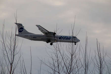 The plane is landing at the Khanty-Mansiysk airport. ATR 72 - medium-range turboprop passenger...