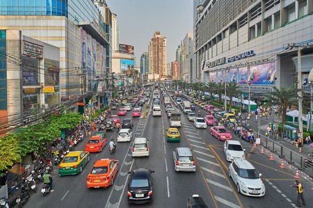 Bangkok, Thailand - February 26, 2014: Traffic moves slowly along a busy road on May 2, 2014 in Bangkok, Thailand. Annually an estimated 150,000 new cars join the already heavily congested streets of Bangkok. Bangkok, Thailand - February 26, 2014のeditorial素材